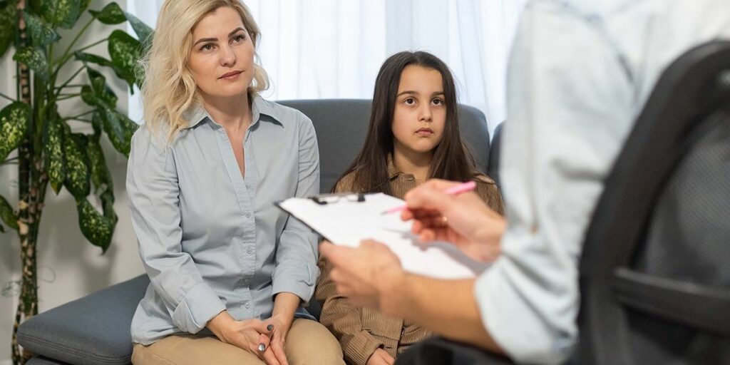 Trump admin tells states to stop Medicaid for trans minors Rehmat Boutique parent child doctors office evaluation.jpg
